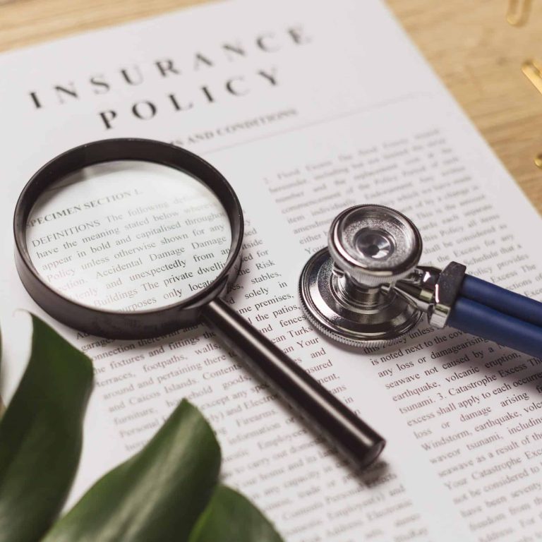 Health insurance. Doctor's stethoscope, magnifier and health insurance document